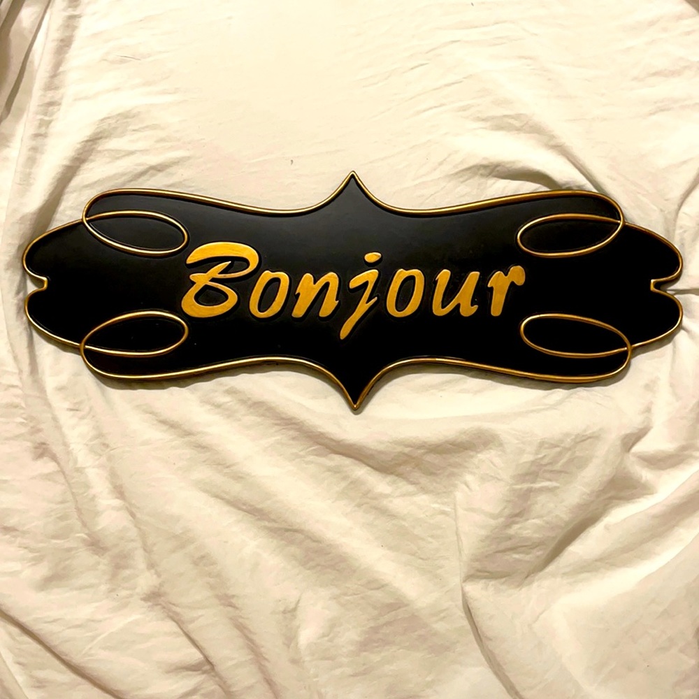 Bonjour sign in black and gold